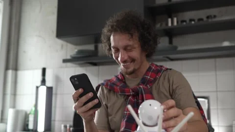 One man install setup home security surveillance camera on smartphone Stock Footage 249401031