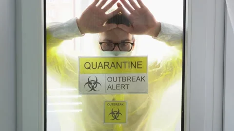 One man stares longingly out window, pushes glass. Isolation. Quarantine zone. Stock Footage 131467987