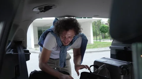 One man travel put stuff belongings to back of car prepare for travel 스톡 동영상 248168513