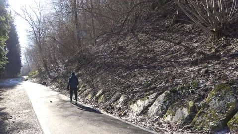 One man walking on cylce route of Valsassina, backlight Stock-Footage 150744022