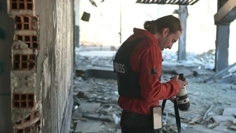 One man, war journalist with digital camera at the place of action, in war zo Stock Footage 166805186