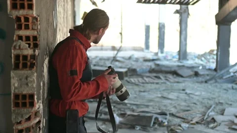 One man, war journalist with digital camera at the place of action, in war zo Video stock 166805224