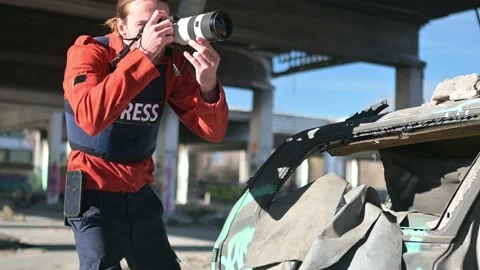One man, war journalist with digital camera at the place of action, in war zo Video stock 166805332