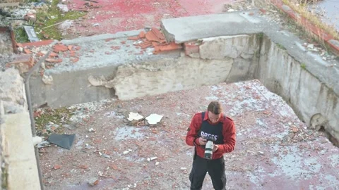 One man, war journalist with digital camera at the place of action, in war zo Video stock 166805405