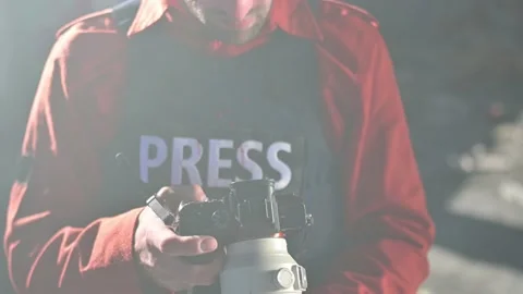 One man, war journalist with digital camera at the place of action, in war zo Stock Footage 166805438