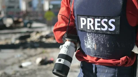 One man, war journalist with digital camera at the place of action, in war zo Video stock 166805569