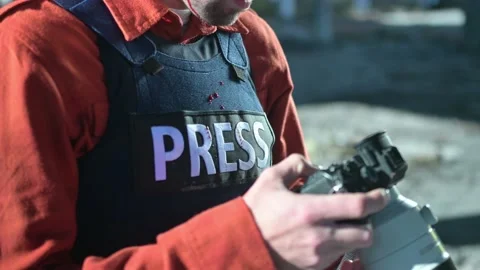 One man, war journalist with digital camera at the place of action, in war zo Video stock 166805573