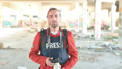 One man, war journalist with digital camera at the place of action, in war zo Video stock 166805586
