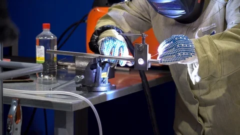 One man working, wearing protective heavy work clothes, white gloves on hands Stock Footage 126356453
