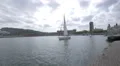 One-masted boat sailing in the port of Barcelona 4k or 4k+ Resolution