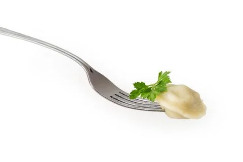 One meat dumpling on fork on white background close-up Stock Photos