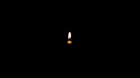 One memorial candle burning on a dark background Stock Footage 195151985
