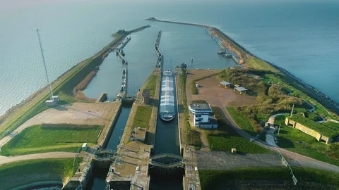 [One Minute] Large Cargo Ship Entering Sluice - Friesland, Holland – 4K Drone Stock-Footage 127576442