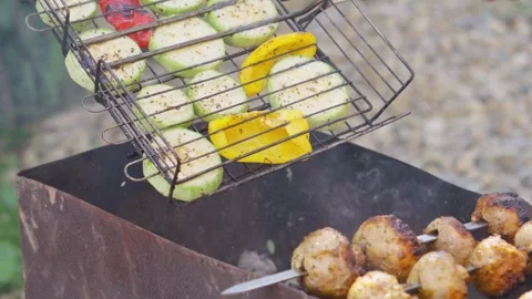 One of the most enjoyable activities at barbecues and picnics is grilling Stock Footage 280307717