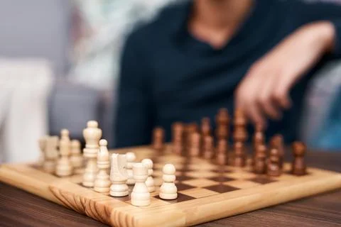 One move makes all the difference. an unrecognisable man playing a game of Stock Photos