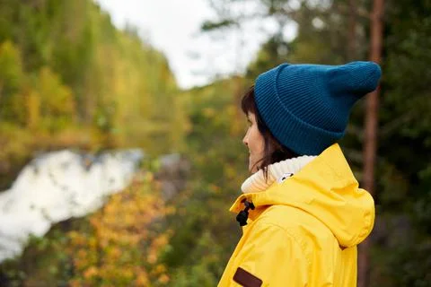 One with nature. Back view of unrecognizable woman looking to forest and Stock Photos