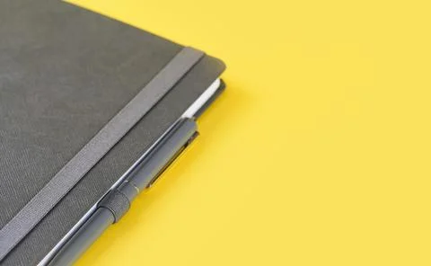 One notebook or diary on trendy yellow background Stock Photos
