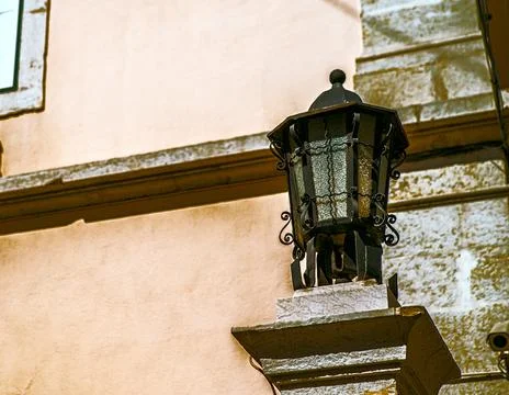 One old black iron lantern with white glass Stock Photos