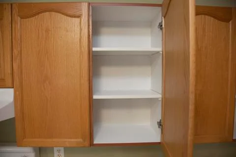 One open cupboard Stock Photos