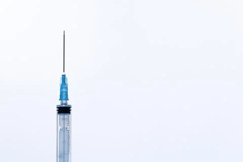 One open disposable plastic injection syringe, a white background Foto stock