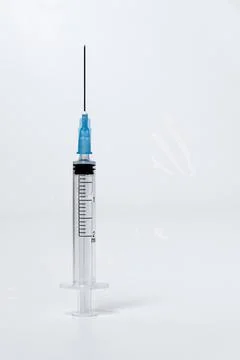 One open disposable plastic injection syringe Stock Photos