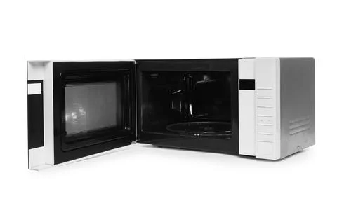One open microwave oven isolated on white Stock Photos