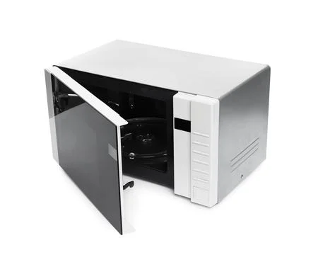 One open microwave oven isolated on white Stock Photos