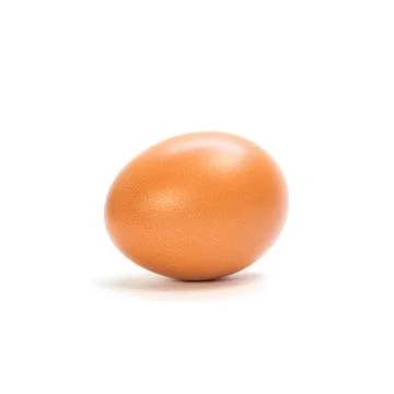 One orange chicken egg. Close up. Isolated on white background Stock-Fotos