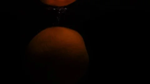 One orange falls in water with bubbles. Video in slow motion. Stock Footage 105427960