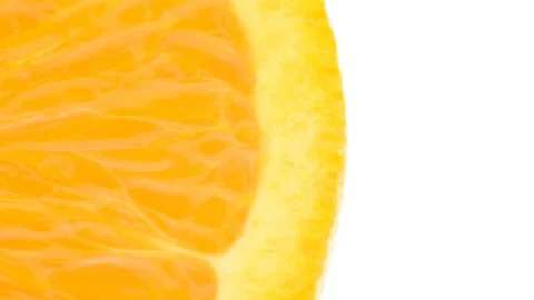 One orange half - extreme closeup pan with extreme detail Stock Footage 104838569
