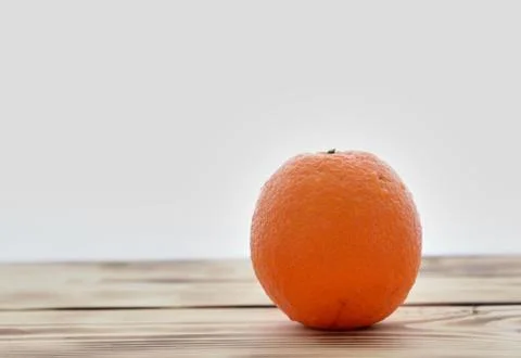 One orange on white background Stock Photos