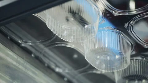 One-off package and pack. Goods manufactured of plastic packing from environment Stock Footage 199487301