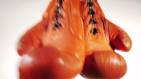 One Pair Red Boxing Gloves Swinging Stock Footage 691460
