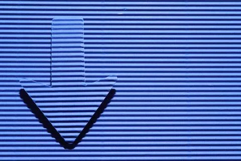 One paper arrow on blue background, top view. Space for text Stock Photos
