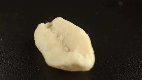 One part of salted peanuts on the dark surface of the table. The concept of food Stock Footage 164232408