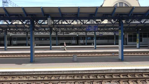 One passenger hurries up on the empty platform of the Kyiv railroad terminal Stock Footage 141339254