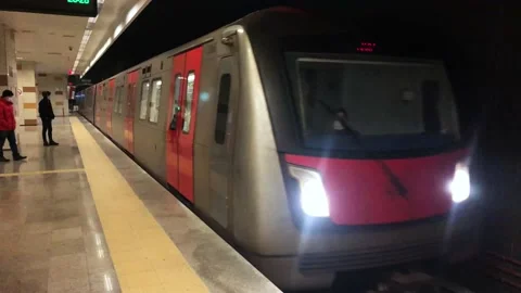 One passenger standing and looking forward for the coming subway Stock Footage 145386348