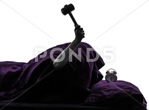 One person bed smashing alarm clock silhouette Stock Photos