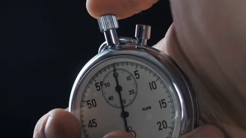 One person starting up a stopwatch Vídeos de archivo 74014060