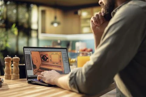 One person working as game programmer with laptop to build virtual 3D world Stock Photos