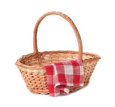 One picnic wicker basket with checkered napkin isolated on white Photos