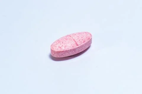 One pill on white background Stock Photos