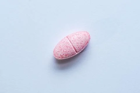 One pill on white background Stock Photos