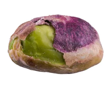 One pistachio nut without shell, isolated on white background Stock Photos