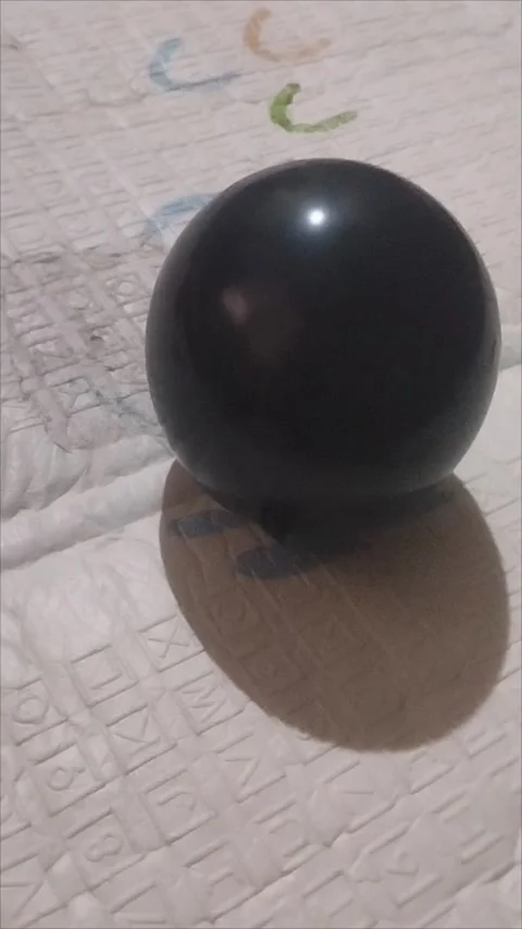 One plain black party balloon Stock Footage 294733127