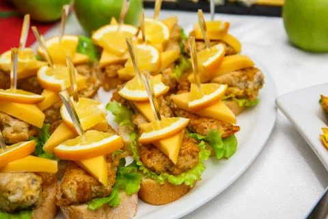 One plate with snacks on a buffet table. Selection of tasty bruschetta or can Stock Photos