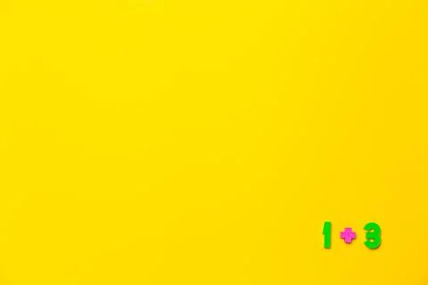 One plus three equals four is example on yellow background. Copy space. Math 스톡 사진