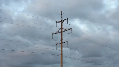 One power pole against background of grey cloudy sky and slowly floating clouds. Stock-Footage 252040455