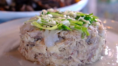 One of the process of Chinese Sichuan famous cold chicken salad, add seasoning Stock Footage 129574154