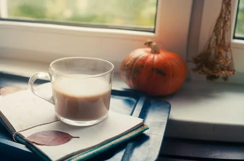 One pumpkin squash and a latte coffee made with with plant based oat soya or Stock Photos